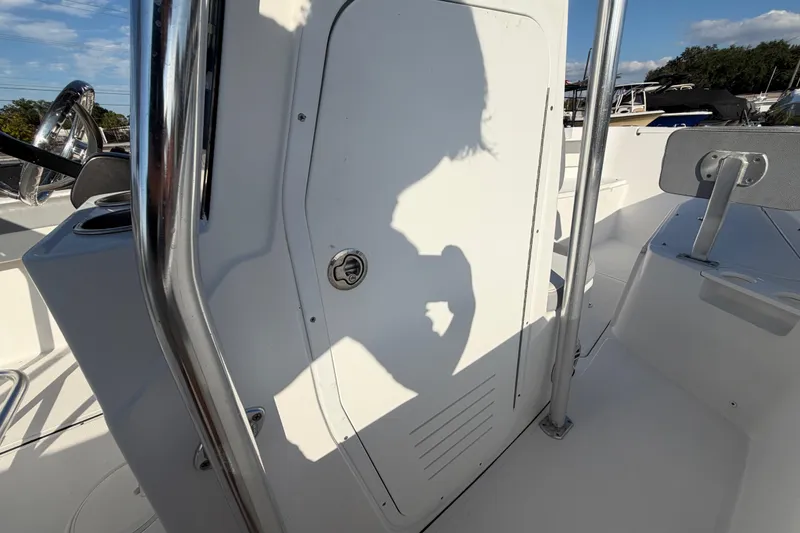Slide: The Image of Shadow on a 2019 Release 208RX boat console, featuring stainless steel railings. - 32