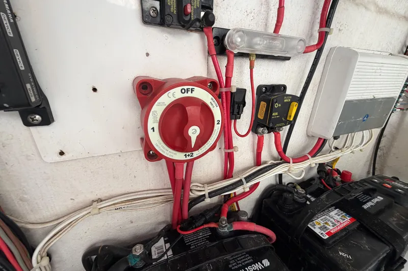 Slide: The Image of Electrical panel with battery switch and wiring in a 2019 Release 208RX boat. - 35