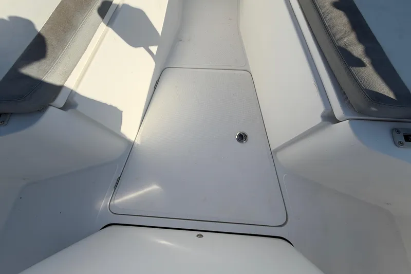 Slide: The Image of 2019 Release 208RX boat interior with storage compartment and seating. - 38