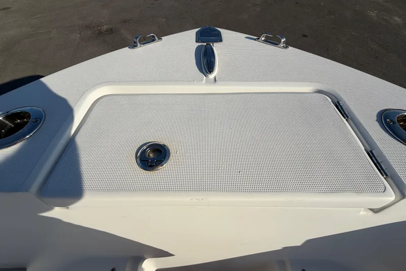 Slide: The Image of Bow of 2019 Release 208RX boat with storage hatch and cleats. - 44