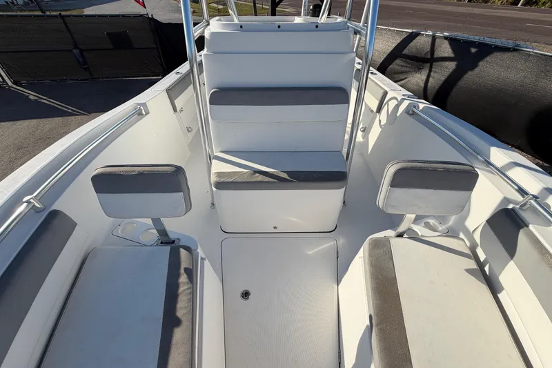 Slide: The Image of Interior of a 2019 Release 208RX boat with cushioned seating. - 48