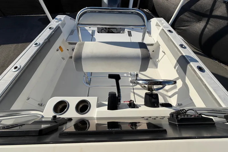 Slide: The Image of 2019 Release 208RX boat cockpit with steering wheel and controls. - 53