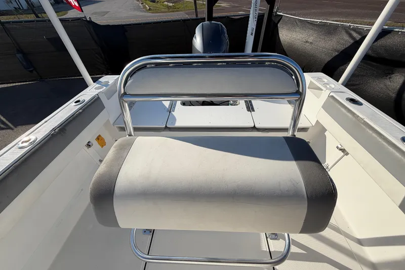 Slide: The Image of 2019 Release 208RX boat interior with cushioned seating and stainless steel frame. - 55