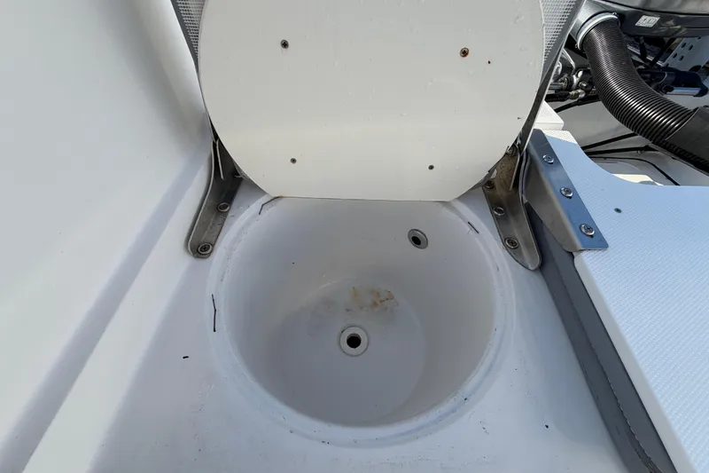 Slide: The Image of Open compartment in 2019 Release 208RX boat, showing interior details and fittings. - 59