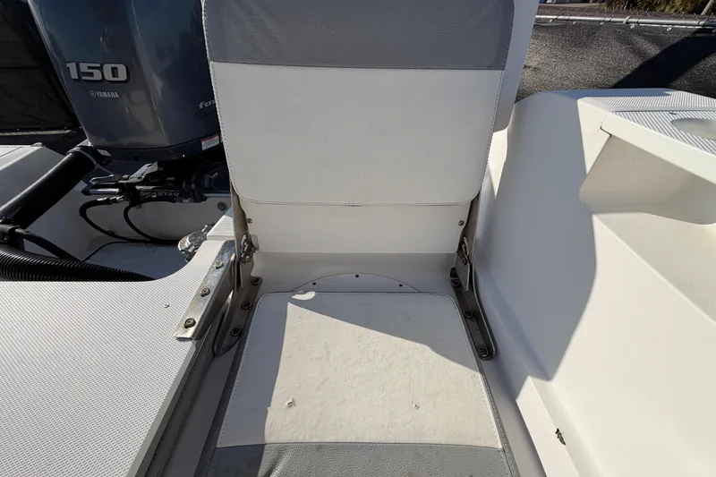 Slide: The Image of 2019 Release 208RX boat seat with Yamaha 150 engine in background. - 64