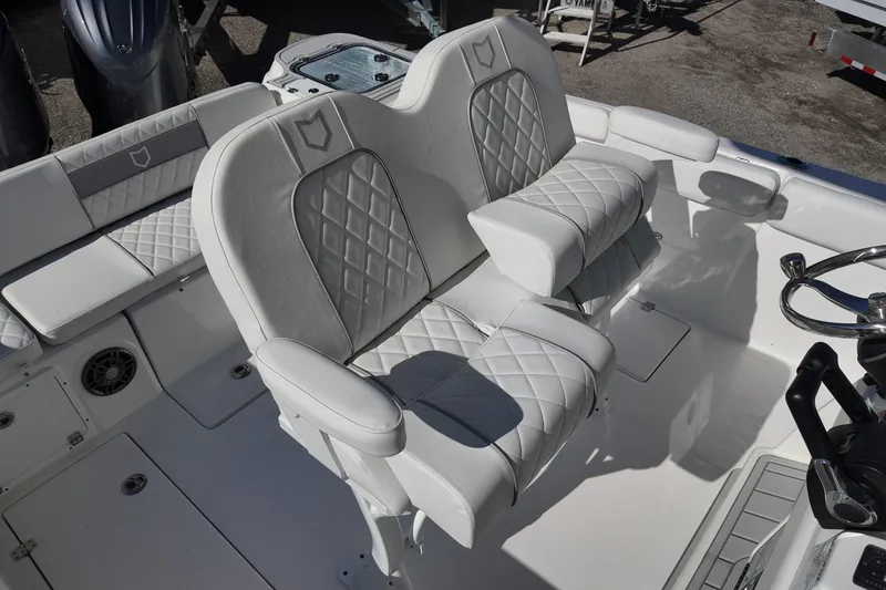 Slide: The Image of 2026 Sea Fox 268 Commander boat interior with luxurious white seating and steering wheel. - 15