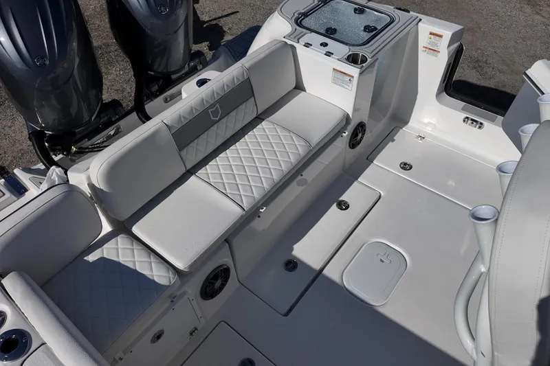 Slide: The Image of 2026 Sea Fox 268 Commander boat interior with cushioned seating and dual engines. - 17