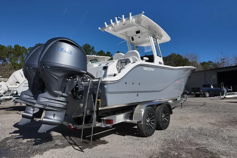 Slide: The Image of 2026 Sea Fox 268 Commander boat with dual Yamaha engines on a trailer. - 4