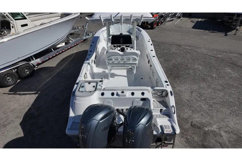 Slide: The Image of 2026 Sea Fox 268 Commander boat with dual Yamaha engines, docked on a trailer. - 5
