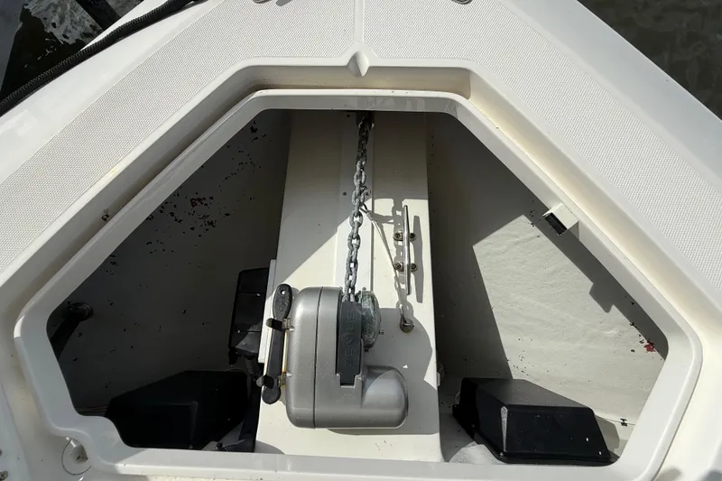 Slide: The Image of Anchor compartment of 2019 SeaVee 390Z boat with chain and winch. - 53