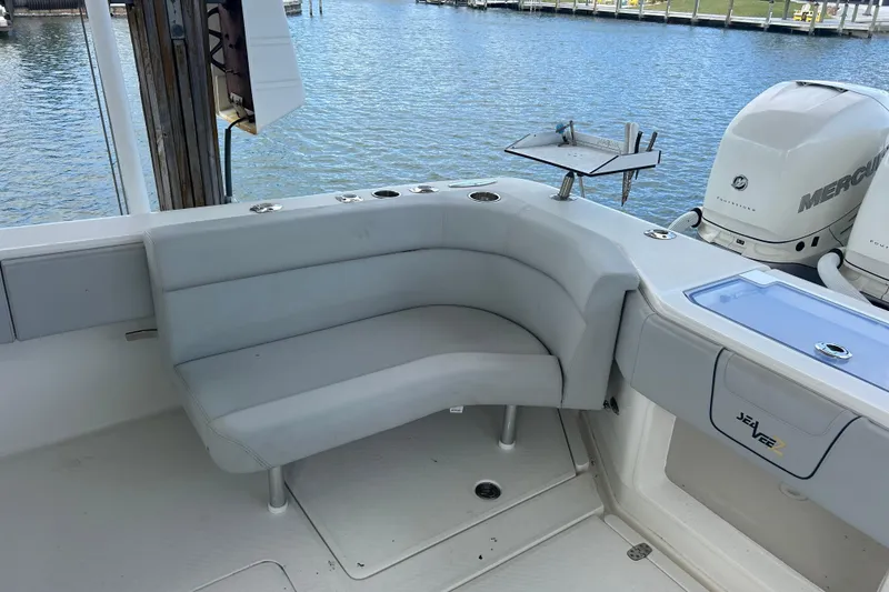 Slide: The Image of 2019 SeaVee 390Z boat interior with seating and Mercury outboard engines. - 82
