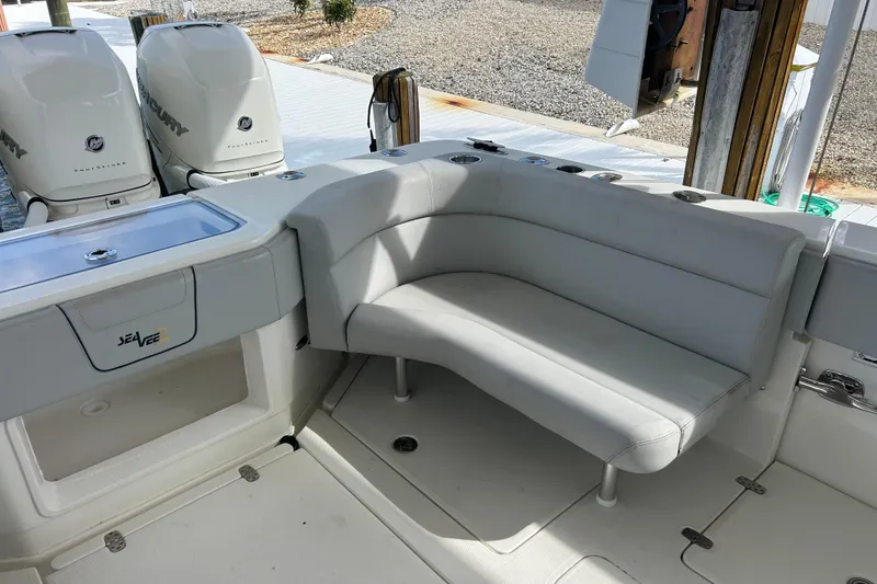 Slide: The Image of 2019 SeaVee 390Z boat interior with seating and twin Mercury engines. - 83