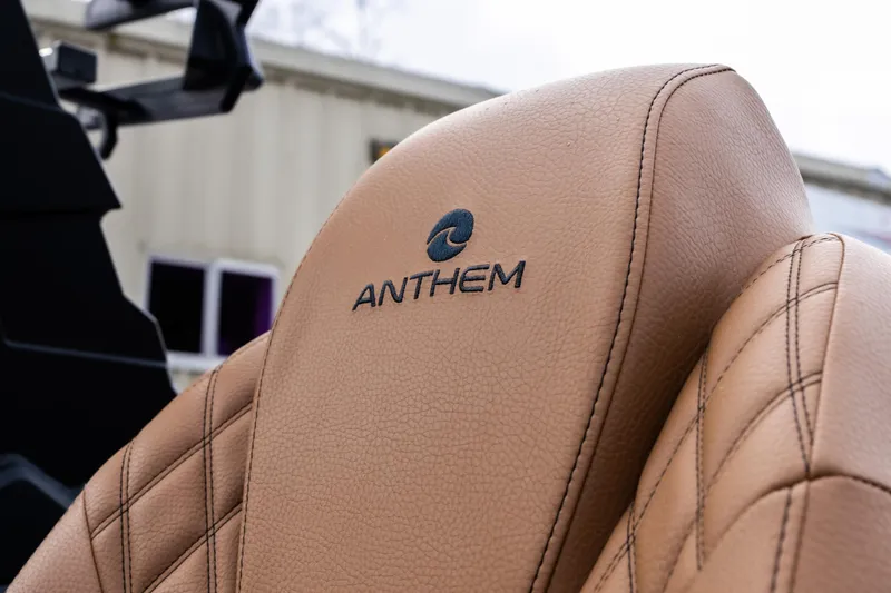 Slide: The Image of 2026 Anthem Assault ST23 seat with logo, featuring tan leather upholstery. - 18