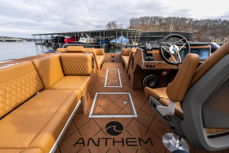 Slide: The Image of Luxurious interior of 2026 Anthem Assault ST23 boat with tan seating and modern controls. - 22