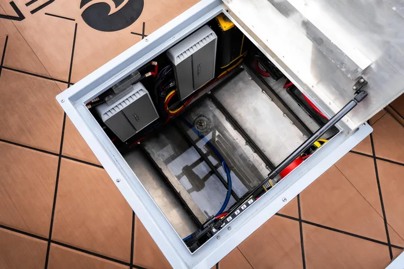 Slide: The Image of Open battery compartment of 2026 Anthem Assault ST23 with visible wiring and components. - 25