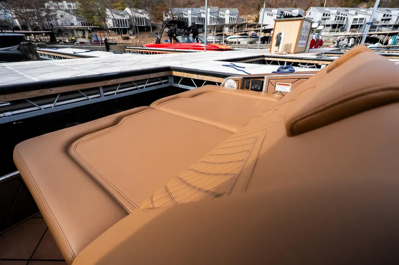 Slide: The Image of Luxurious tan seating on 2026 Anthem Assault ST23 boat at marina. - 26