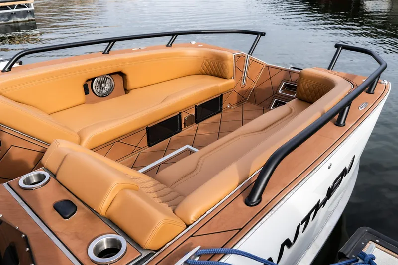 Slide: The Image of Luxurious interior of 2026 Anthem Assault ST23 boat with tan seating and sleek design. - 28