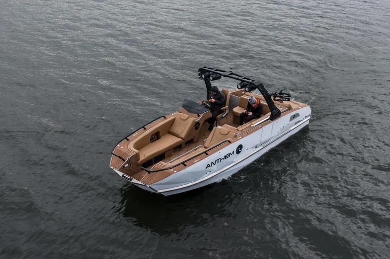 Slide: The Image of 2026 Anthem Assault ST23 boat cruising on water with passengers onboard. - 35