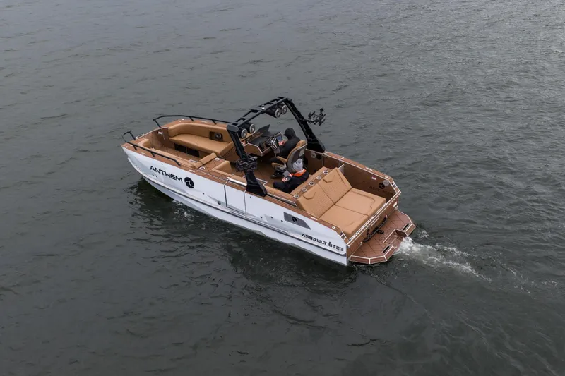 Slide: The Image of 2026 Anthem Assault ST23 boat cruising on open water, featuring sleek design and modern amenities. - 36