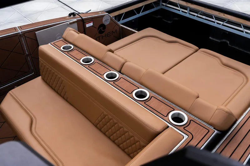 Slide: The Image of Luxurious interior of 2026 Anthem Assault ST23 boat with tan leather seating and cup holders. - 4