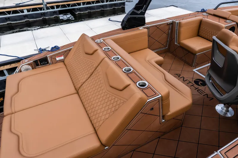 Slide: The Image of Luxurious interior of 2026 Anthem Assault ST23 boat with tan leather seating and cup holders. - 8