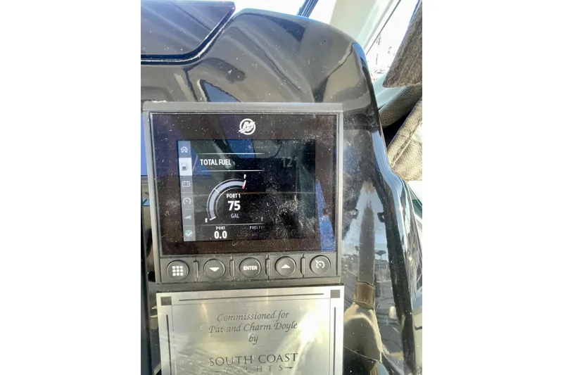 Slide: The Image of Dashboard of 2020 Beneteau Antares 9 showing fuel gauge and controls. - 23