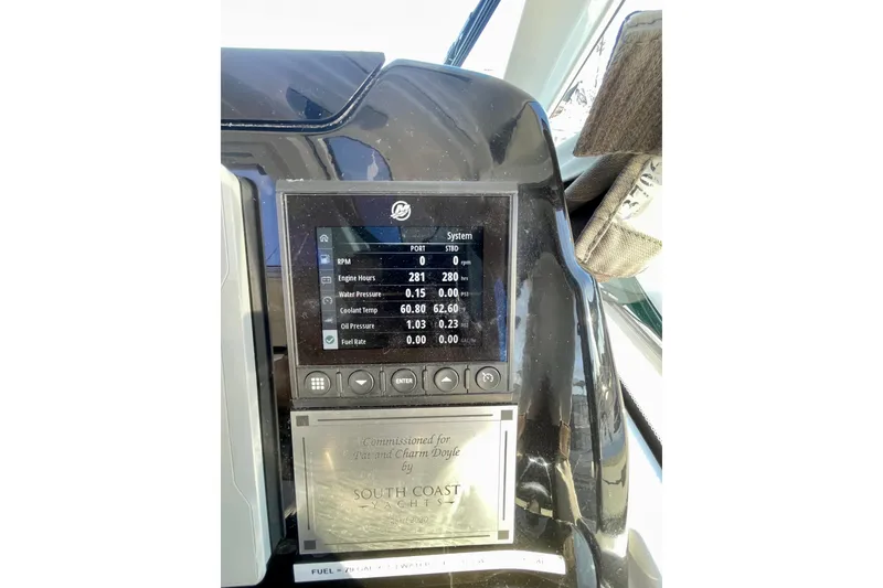 Slide: The Image of Control panel of a 2020 Beneteau Antares 9 displaying engine metrics. - 24