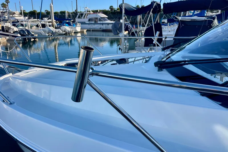 Slide: The Image of 2020 Beneteau Antares 9 docked in a marina, showcasing sleek design and chrome details. - 27