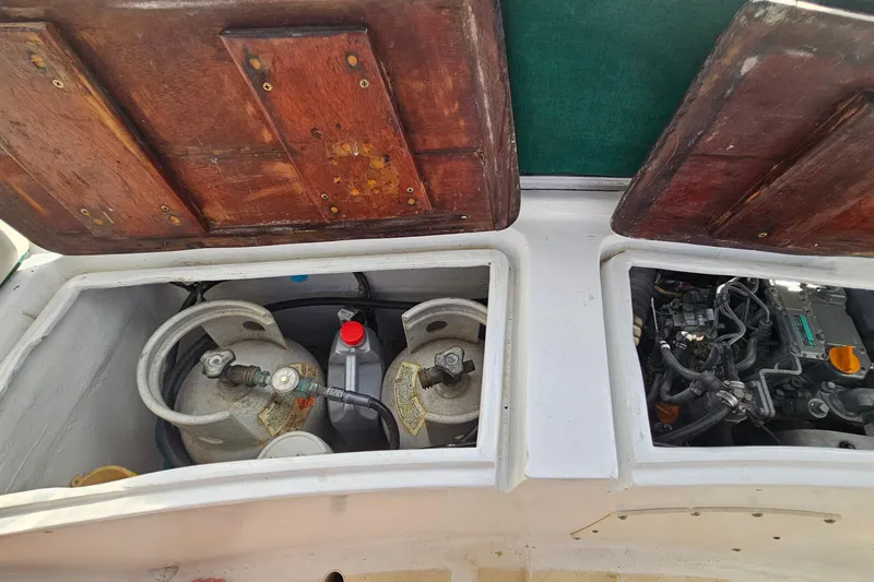 Slide: The Image of 1973 Prout 35 sailboat deck with solar panels and wooden steps. - 10