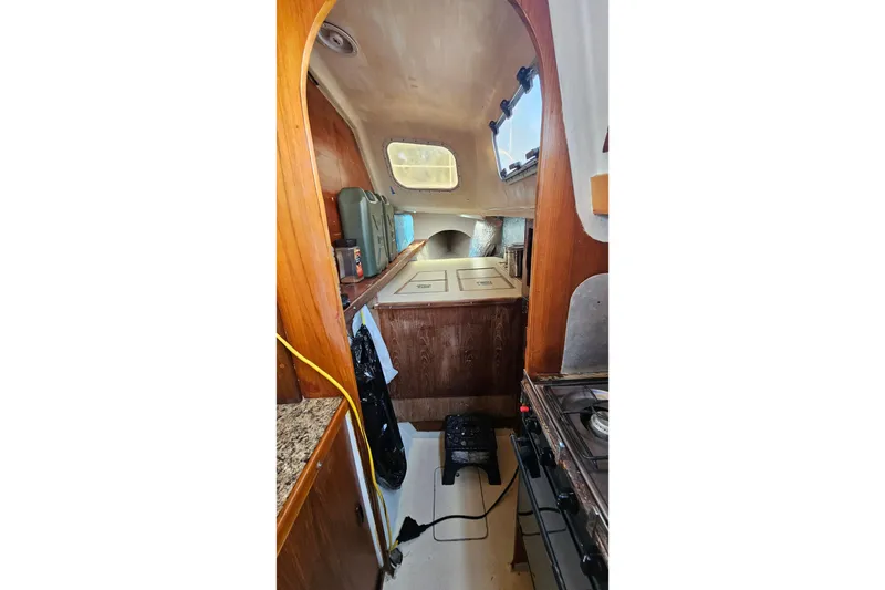 Slide: The Image of 1973 Prout 35 boat interior showing electrical and gas control panels. - 23