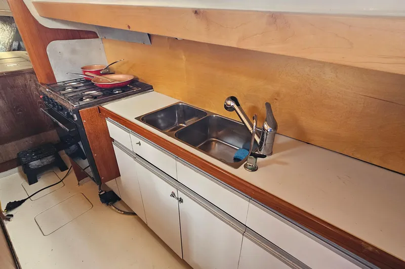 Slide: The Image of Anchor chain compartment on a 1973 Prout 35 boat, showing storage area. - 27