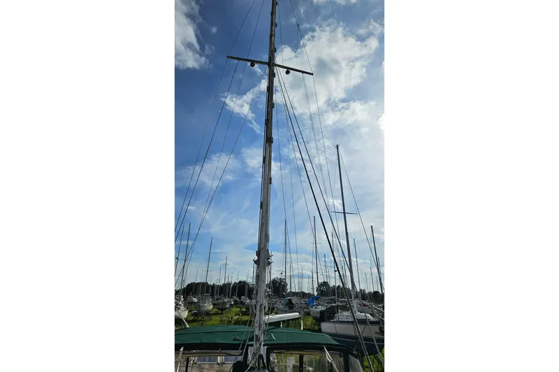 Slide: The Image of Rope and metal bar on weathered surface of 1973 Prout 35 boat. - 30