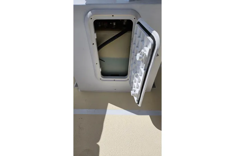 Slide: The Image of Open hatch on 1973 Prout 35 boat, showing interior compartment. - 37