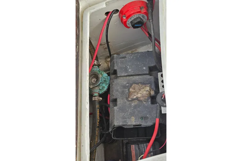 Slide: The Image of Battery compartment of a 1973 Prout 35 boat with wiring and switch. - 38
