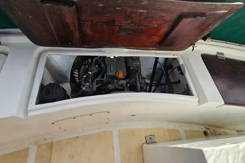 Slide: The Image of Engine compartment of a 1973 Prout 35 boat with open wooden hatch. - 41