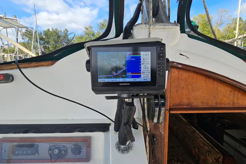 Slide: The Image of Interior of a 1973 Prout 35 boat with steering wheel and seating area. - 9