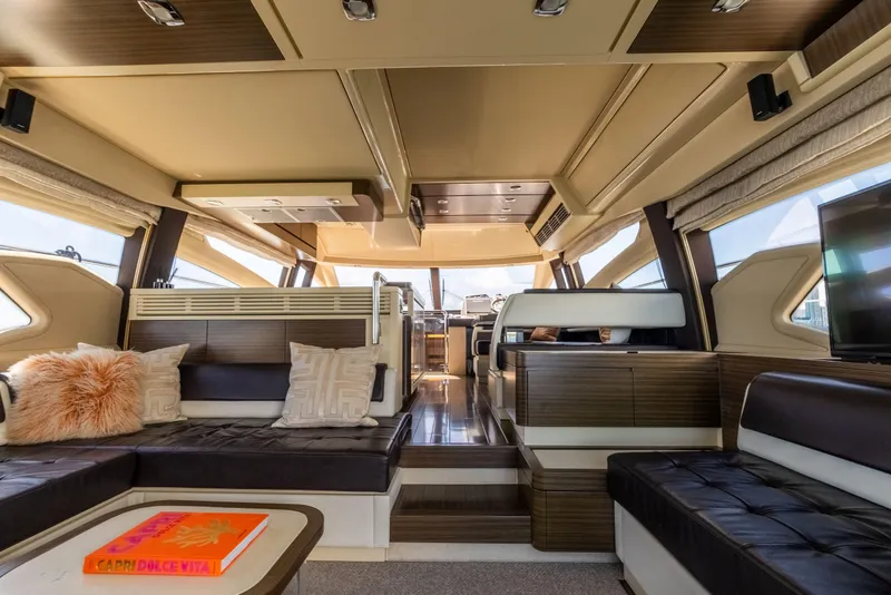 Slide: The Image of Luxurious interior of 2016 Azimut 64 Flybridge yacht with modern seating and decor. - 14