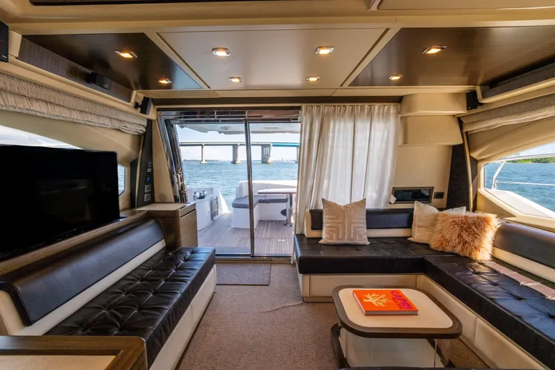 Slide: The Image of Luxurious interior of 2016 Azimut 64 Flybridge yacht with elegant seating and ocean view. - 15