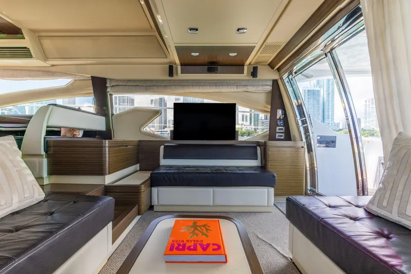 Slide: The Image of Luxurious interior of 2016 Azimut 64 Flybridge yacht with modern furnishings and city view. - 17