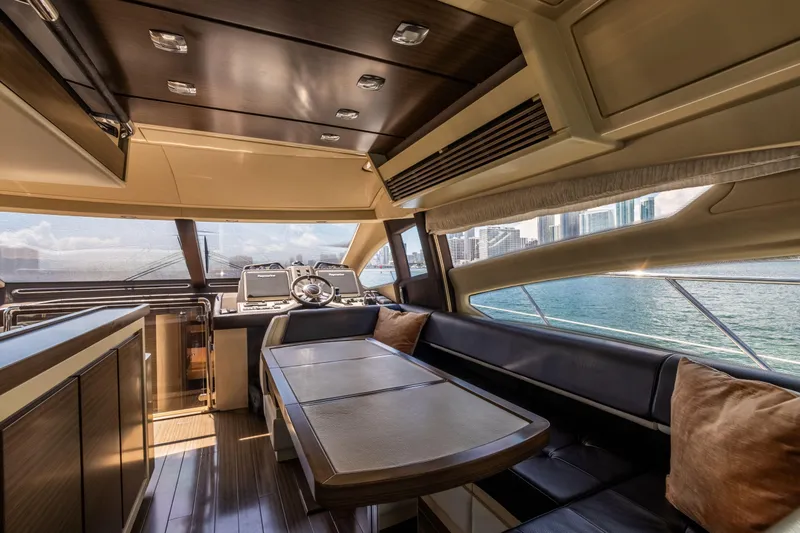 Slide: The Image of Luxurious interior of 2016 Azimut 64 Flybridge yacht with elegant seating and scenic views. - 20