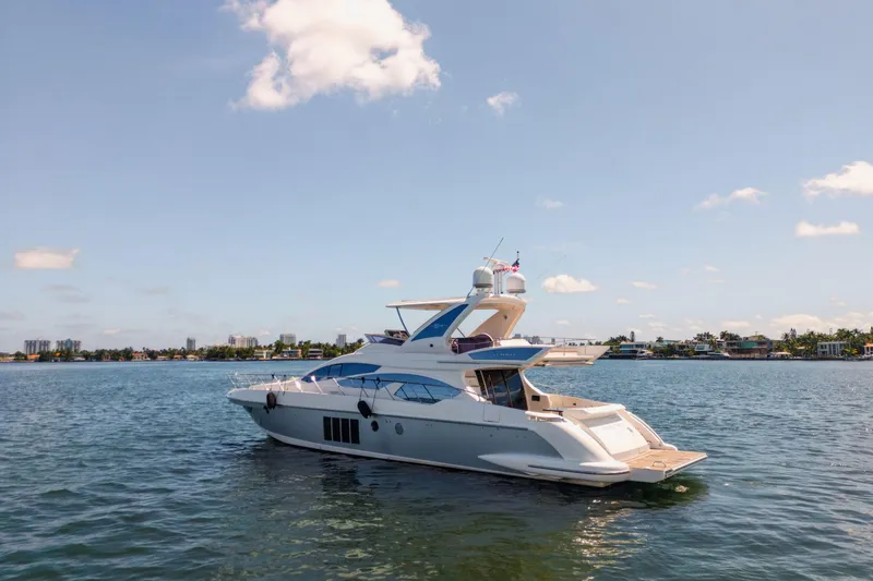 Slide: The Image of 2016 Azimut 64 Flybridge yacht cruising on a sunny day. - 3