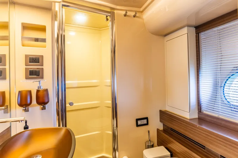 Slide: The Image of Luxurious bathroom in 2016 Azimut 64 Flybridge yacht with modern fixtures and elegant design. - 30