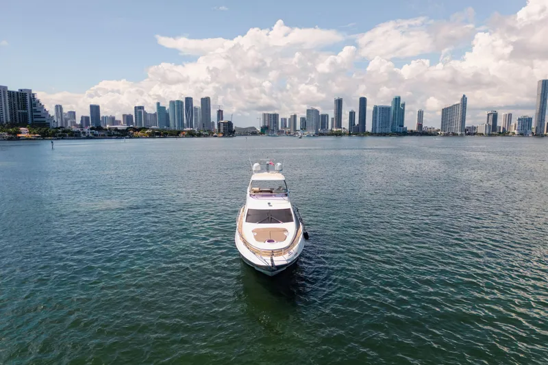 Slide: The Image of Azimut 64 Flybridge yacht on water with city skyline, 2016 model. - 4