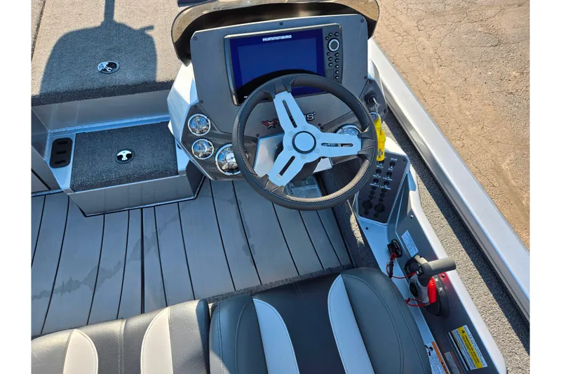 Slide: The Image of 2023 Vexus AVX1980 boat cockpit with steering wheel and control panel. - 12