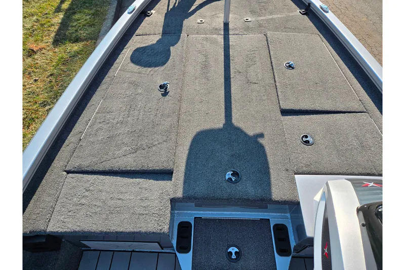 Slide: The Image of 2023 Vexus AVX1980 boat deck with storage compartments and carpeted surface. - 14