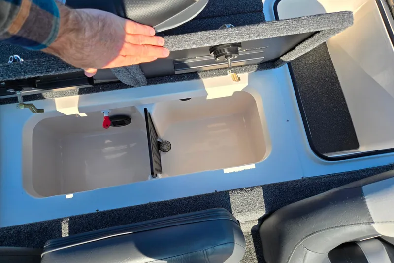 Slide: The Image of 2023 Vexus AVX1980 boat storage compartment with open lid and hand for scale. - 21