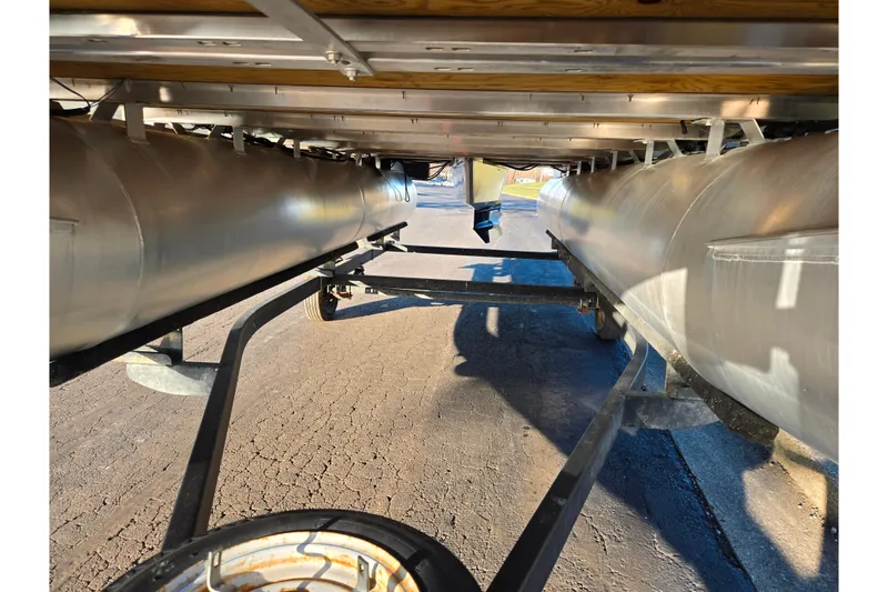Slide: The Image of Underneath view of a 2021 Starcraft EX 20 R pontoon boat on a trailer. - 7
