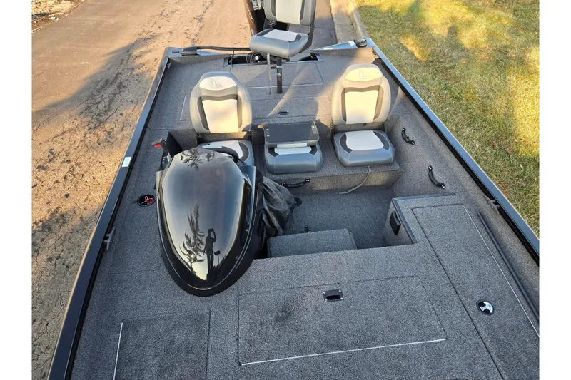 Slide: The Image of 2023 Lowe Stinger 175C boat interior with seating and storage compartments. - 19