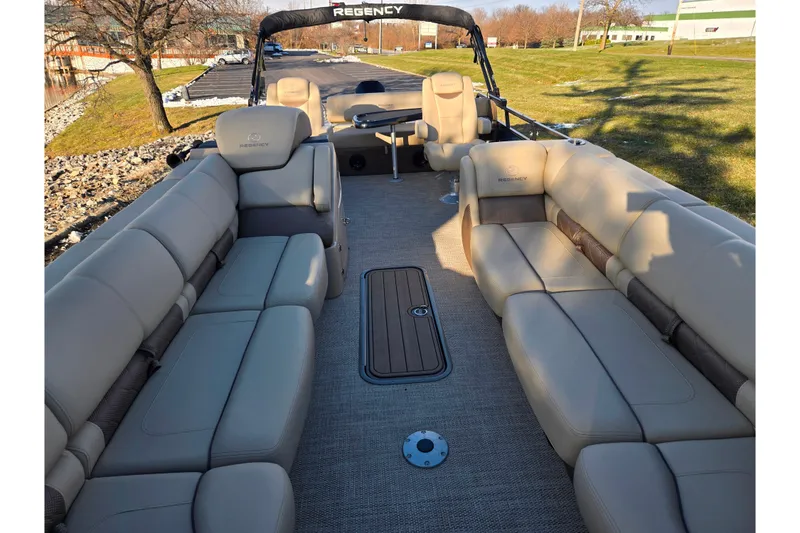 Slide: The Image of 2024 Regency 250 LE3 Sport pontoon boat interior with luxurious seating and spacious layout. - 12
