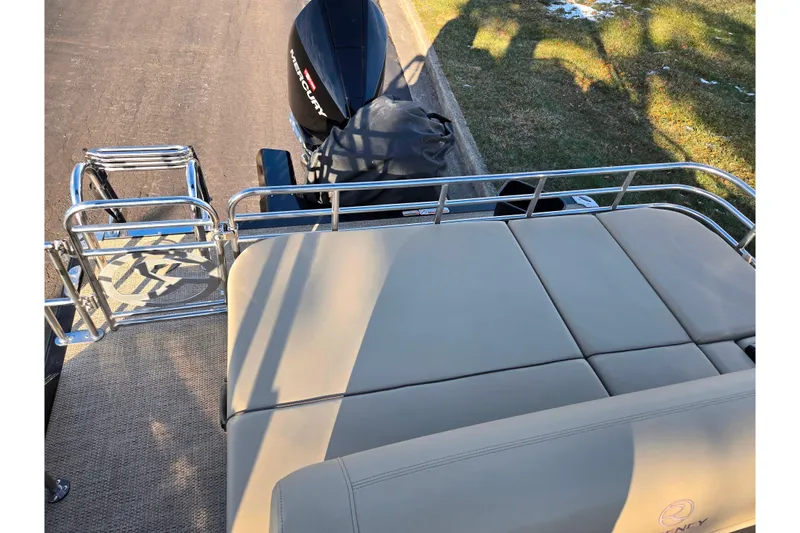 Slide: The Image of 2024 Regency 250 LE3 Sport boat with cushioned seating and Mercury outboard motor. - 16